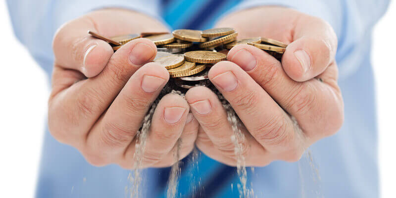 Image of a man with coins slipping through fingers: Can property auction sales fall through?