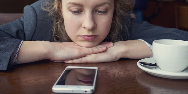 Lady waiting watching her phone. What time does completion take place on completion day? 