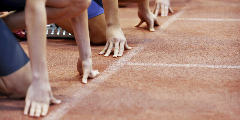 Racers at a starting line. Concept image do the article "do auctions start at the guide price?" 