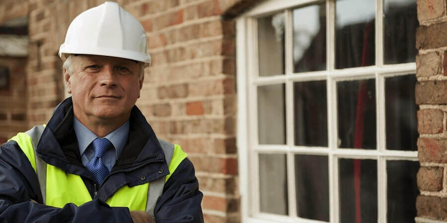 Surveyor in front of a property. Is it possible to get a survey on an auction property?