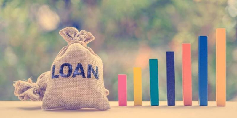 Image of a bag of money with the word "loan" on it. Can you get a loan for an auction property?