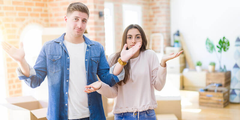 Image of two siblings who have inherited a home and are confused about the process. 