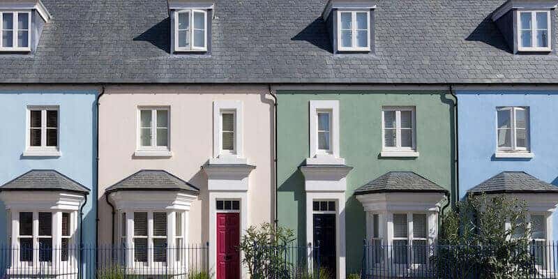 Image of a row of colourful houses: Do you need to pay stamp duty on an inherited home?