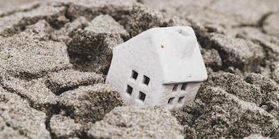 Can you sell a house with subsidence. Toy house sinking and subsiding into ground.