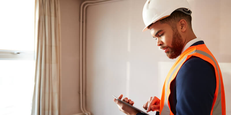A structural engineer inspecting a property.