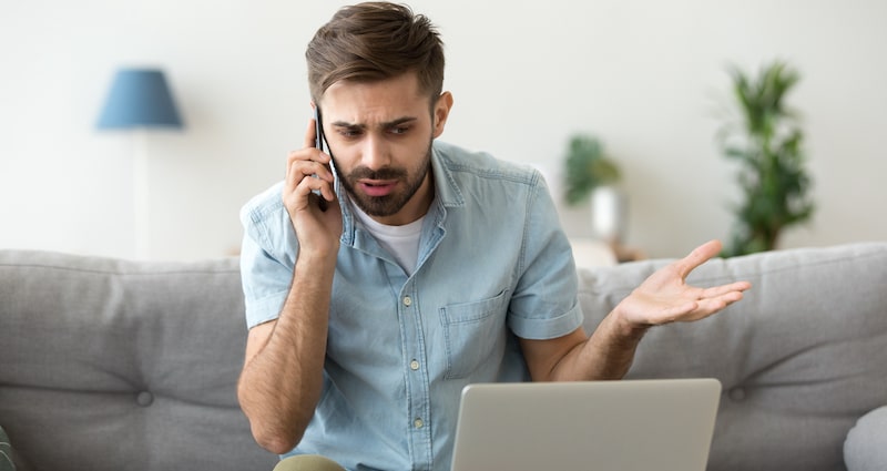 Picture of a man receiving a bad phone call. This can happen when you use a dodgy house-buying company.