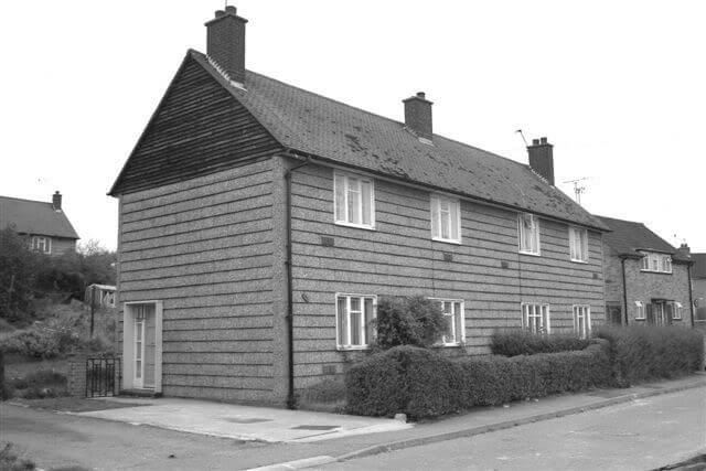 A black and white image of an Airey house.