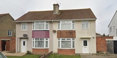 A google maps street view image of Laing Easiform semi detached houses with bay windows. Laing Easiform houses, the complete guide.