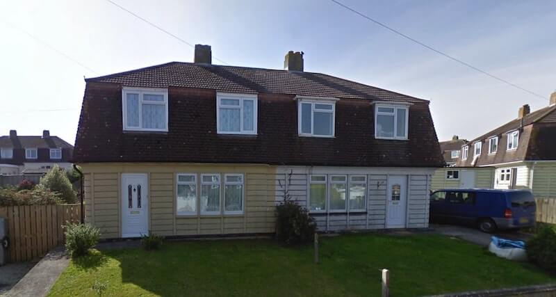 Semi-detached Cornish Unit Type 1 houses in their unmodified form.