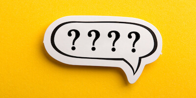 Question mark speech bubble isolated on yellow background. Is it worth selling your house to a house buying company?