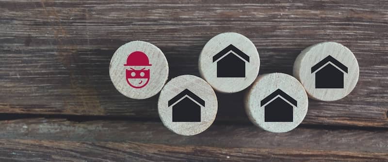 Image of 4 house tokens and a scammer - this section is about the scams to watch out for.