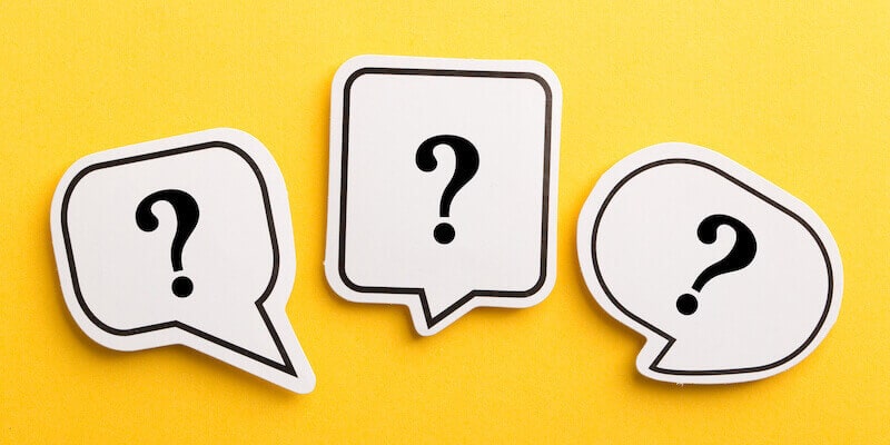 Question mark speech bubble on yellow background. Is it worth selling your house by auction?