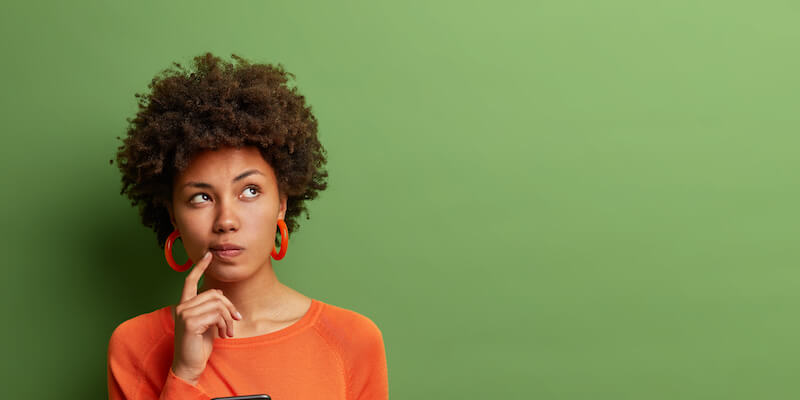 Lady looking confused making a decision. When should you change estate agents?