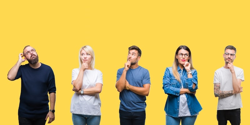 Five confused people on a yellow background. Top 5 reasons why people sell their houses by modern auction.