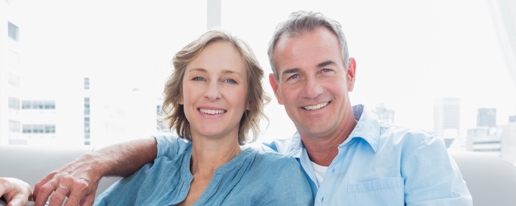 Picture of a happy couple after selling their house fast.