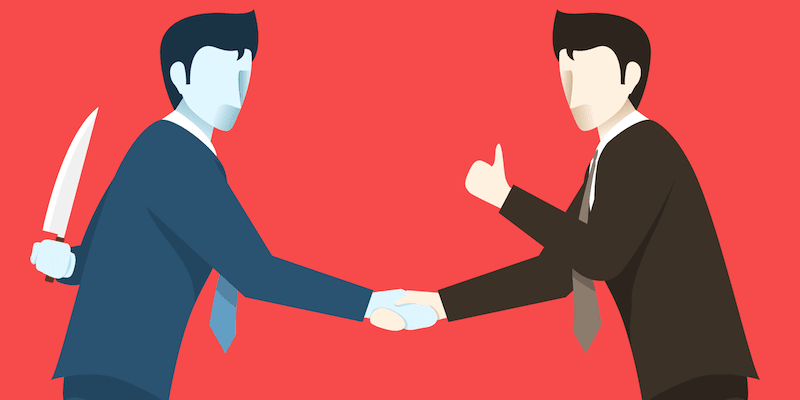 We buy any house scams: A business man shaking hands with a dagger behind his back